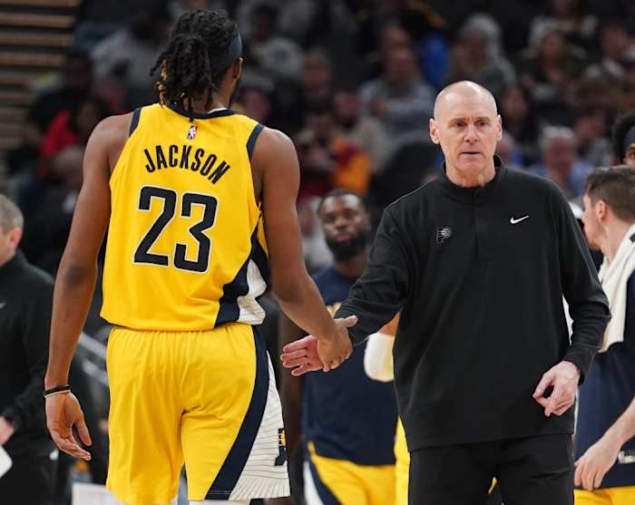 Pacers head coach Rick Carlisle high fives rookie center Isaiah Jackson during a timeout.
